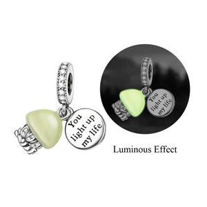 Luminous silver pendant with glowing stone and You light up my life engraved disk