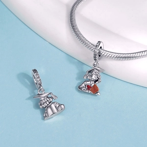 Close-up of S925 sterling silver graduation girl pendant with orange enamel and zircon