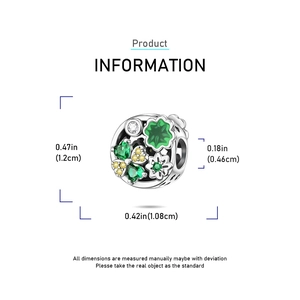 Detailed macro view showing dimensions of silver clover bead with green enamel and heart cutouts