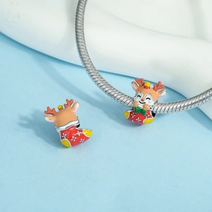 Detail of Christmas reindeer charms on silver snake chain with red enamel holiday socks