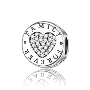 Macro view of silver heart charm with cubic zirconia and Family Forever engraving