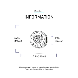 Detailed macro view showing Family Forever engraving and heart zircon on silver charm