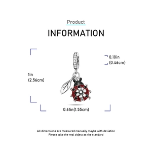 Silver ladybug charm detail with red enamel and dimensions measuring 1.0 by 0.61 inches