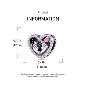 Detailed view of silver heart charm with pink zircon and dimensions of 11mm by 12mm