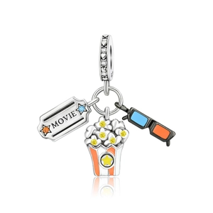 Macro detail of S925 silver movie ticket, popcorn and 3D glasses charm set