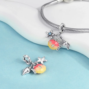 Detail of S925 silver starfish, tropical fish, and seashell charms on a snake chain
