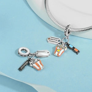 Detail showing S925 silver movie charms with popcorn, 3D glasses and movie ticket pendant