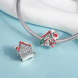 Macro view of Christmas gingerbread house charm in S925 silver with red enamel finish