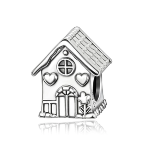 Macro shot of S925 sterling silver house charm showing side engraving and heart details