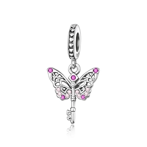 Macro detail of S925 silver butterfly key pendant with pink gemstones and S925 hallmark