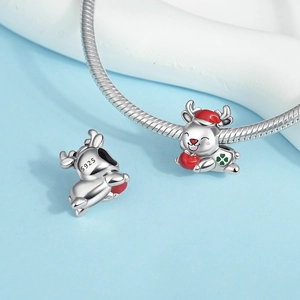 Macro shot of S925 silver Christmas reindeer charm with red enamel hat on snake chain