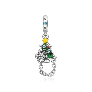 Detailed view of Christmas tree charm with enamel, snowflake and colorful gemstones