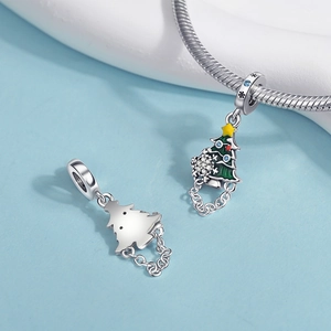 Detail of silver Christmas tree charm with green enamel and multi-colored zircons