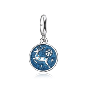 Macro detail of reindeer charm with blue enamel and sparkling stars for DIY jewelry