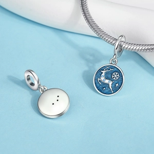 Detail of blue enamel reindeer charm with silver snowflakes and sparkling crystals