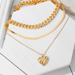 Three-layer gold layered necklace set with heart pendant and thick curb chain jewelry