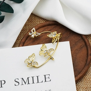 Sparkling gold butterfly ear cuff with rhinestones for women in elegant butterfly design