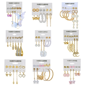 Macro display of nine fashion earring sets with pearls, crystals and butterfly tassels