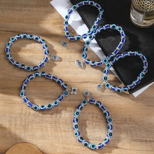 Set de tobilleras de ojo turco con abalorios y dijes de mano de Fátima de plata