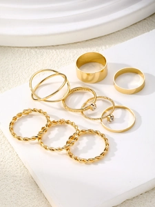 Detail view of 8pcs golden twisted geometric ring set with sparkling zircon accents