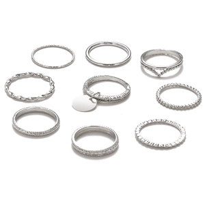 9-piece set of silver metallic twist and geometric rings in minimalist fashion style