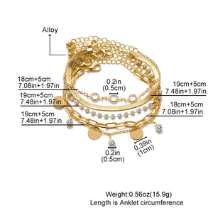 Set di 5 cavigliere dorate con catene a serpente e cubane, con ciondoli e strass brillanti