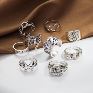 Retro vintage 8-piece silver ring set featuring butterfly heart and punk snake designs