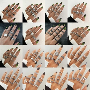 Detail view of 16-piece retro snake and butterfly ring set with bohemian oxidized finish