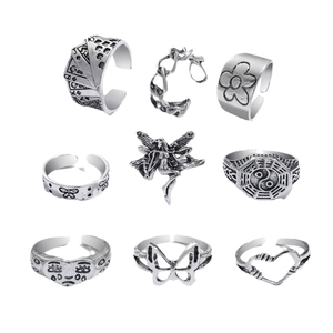 9-piece set of vintage oxidized silver rings featuring butterfly and snake motifs