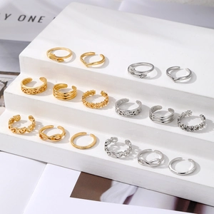Set of 14 adjustable boho rings with hollow floral and geometric patterns in gold and silver