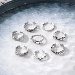 8-piece set of silver open rings with floral carvings and geometric hollow designs