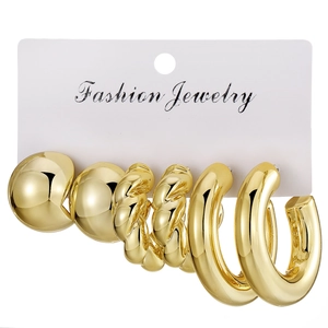 Three-pair gold earring set featuring textured twist hoops and polished ball studs
