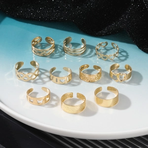 10-piece gold bohemian toe ring set with sun moon and geometric cutout designs