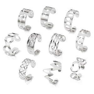 Detail view of 10-piece silver open ring set with star and moon hollow designs