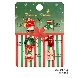 Detailed view of five-piece Christmas brooch set in alloy with festive size markings