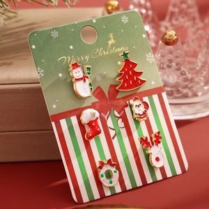 6-piece Christmas earring set with snowman, tree, and reindeer on festive card