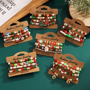 Christmas beaded bracelet set with acrylic charms of Santa snowman and snowflakes