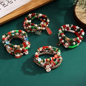 Christmas beaded bracelet set with acrylic snowflakes, bells, and holiday charms