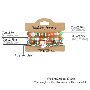 Detail of Christmas beaded bracelet set showing snowmen charms and adjustable elastic band