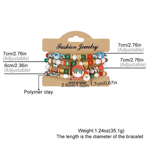 Detail of colorful Christmas bead bracelets with snowman and Santa charms on display card
