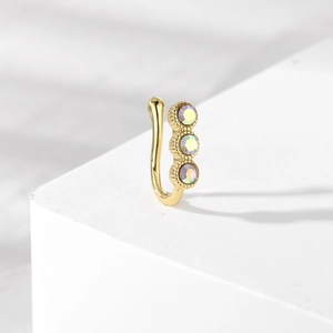Detail of gold U-shaped non-piercing nose ring with three aurora crystal rhinestones
