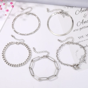 Five-piece silver jewelry bracelet set featuring Figaro, snake, and Cuban link chains