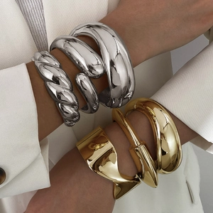 Chic punk style wide irregular metal bracelets in polished gold and silver finishes