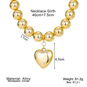 Chunky gold bead necklace with large heart pendant in polished alloy, 40cm plus extender