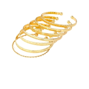 Set of 6 gold-plated alloy bracelets featuring textured geometric patterns and star engravings