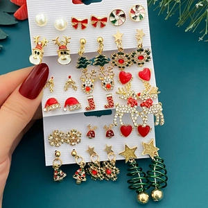 Detailed close-up of Christmas earring set featuring reindeer and snowflake charms