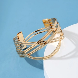 Golden hollow woven metal open cuff bracelet with geometric wave layered design