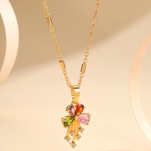 Gold-plated bow necklace featuring colorful pear-cut zircons and sparkling tassel accents