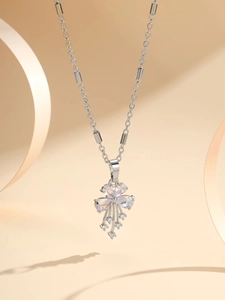 Detail showing elegant flower pendant with sparkling zircon crystals and silver tassel chain