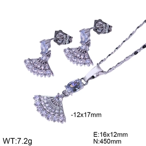 Macro detail of silver fan-shaped jewelry set with necklace, studs and cubic zirconia